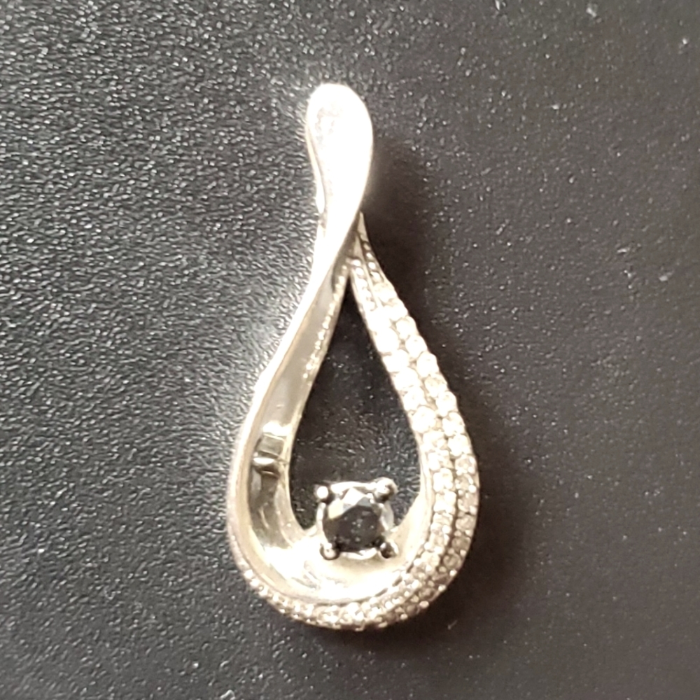Sterling pendant with diamonds and a larger black diamond.
